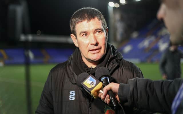 Mansfield Town manager Nigel Clough speaks to the media at Prenton Park.