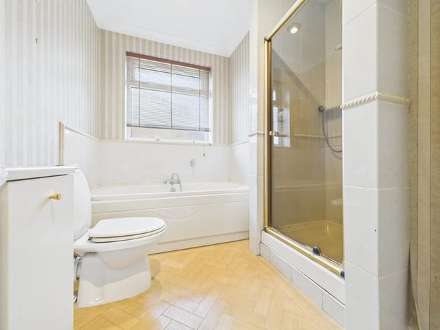 A second family bathroom featuring a separate shower cubicle