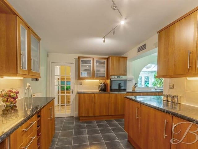 The kitchen features matching wall and base units and cabinets, and an excellent amount of worktop space to showcase your culinary skills. Integrated appliances include an oven and a dishwasher.