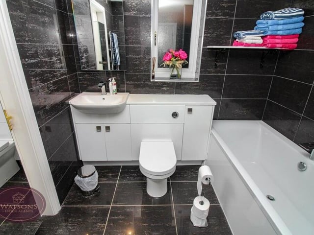 The main bathroom at the £450,000-plus property is on the ground floor. An eyecatching four-piece suite consists of a bath and shower cubicle, with mains shower, vanity sink unit and WC. There are also a chrome, heated towel-rail, tiled flooring and ceiling spotlights.