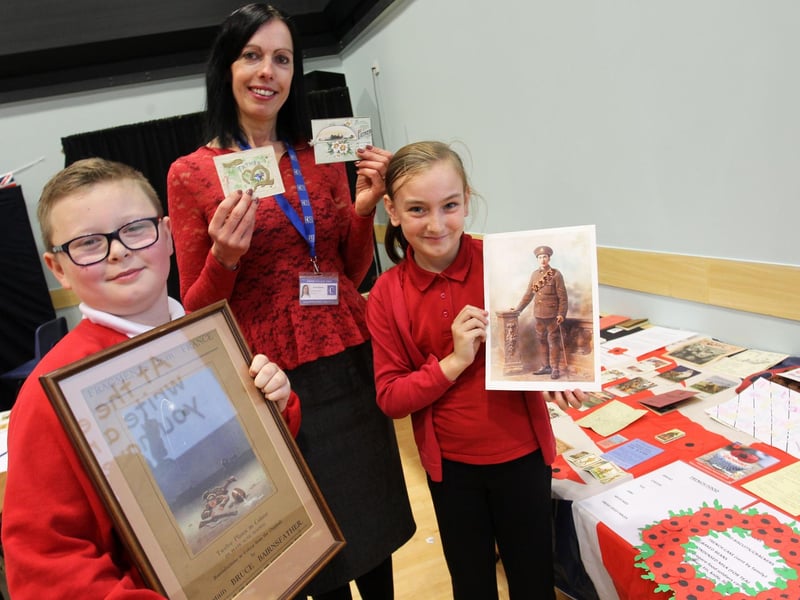 Children from Morven Park Primary took part in a WWI day at Kirkby College in 2014. Pictured are Ethan March, nine, and Paige Morley, nine, with Michelle Roberts.
