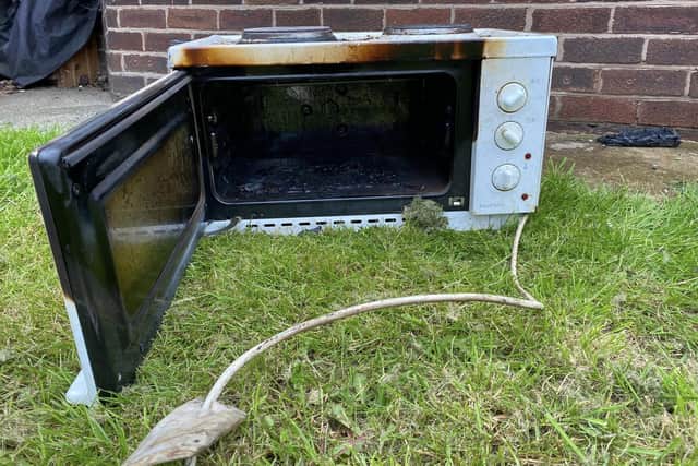 A microwave was badly damaged in the blaze.