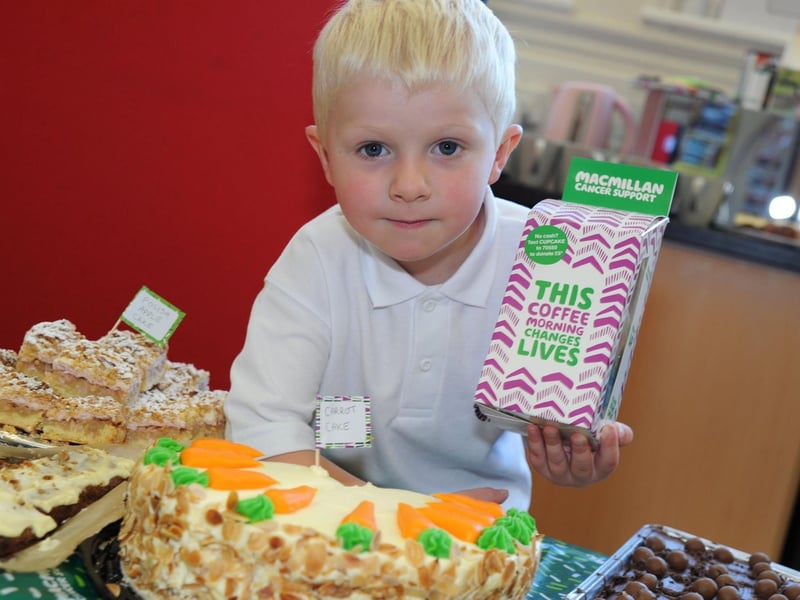King Edward Primary School pupil, Tommy Evans, mans the cake stall at Macmillan coffee morning,