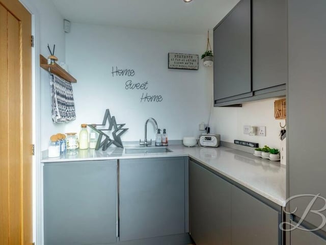 A compact utility room is a convenient addition to the ground floor. It comes complete with a range of modern units, complementary quartz worktops and inset sink with mixer tap over.