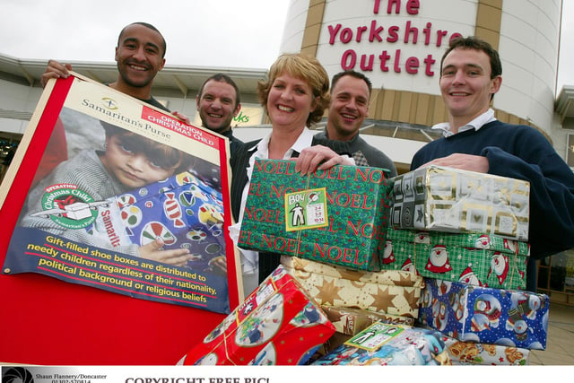 Members of Doncaster Rovers FC  launched Operation Christmas Child at the Yorkshire Outlet in 2003
Pictured with Outlet Manager Cheryl Primrose are L-R Justin Jackson, Gareth Owen, Paul Barnes & Tim Ryan.