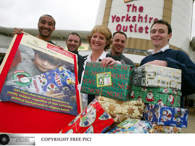 Members of Doncaster Rovers FC  launched Operation Christmas Child at the Yorkshire Outlet in 2003
Pictured with Outlet Manager Cheryl Primrose are L-R Justin Jackson, Gareth Owen, Paul Barnes & Tim Ryan.