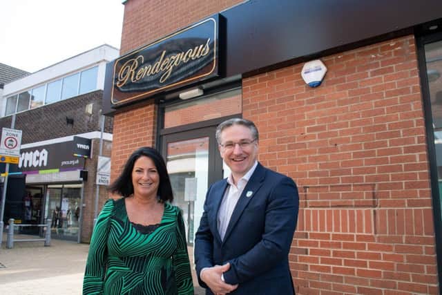Cafe owner Tricia Ironside and Coun Matthew Relf outside Rendezvouz on Low Street, Sutton town centre.