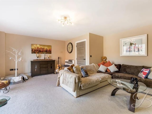 The property has ample space for a growing family, including a cosy living room.