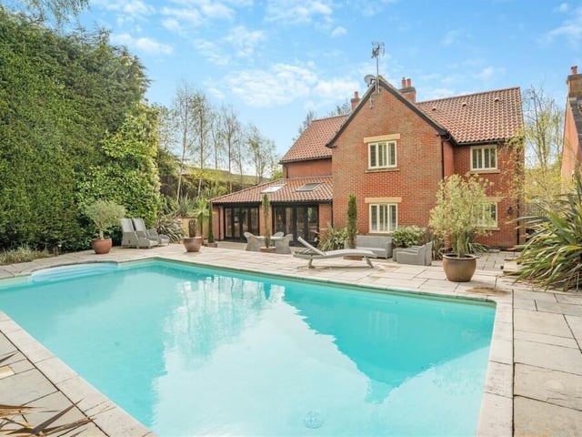 And here's what you've been waiting for -- the heated outdoor swimming pool, which is undoubtedly the highlight of the landscaped rear garden. It measures 8.5 metres by 4.5 metres and benefits from a new, recently installed liner.