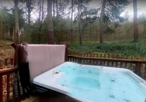 Relax and unwind in a log cabin in the woods. Image: Sherwood Forest Cabins.
