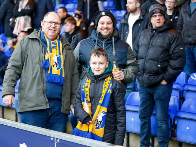 Mansfield Town fans enjoy the win at Stockport County