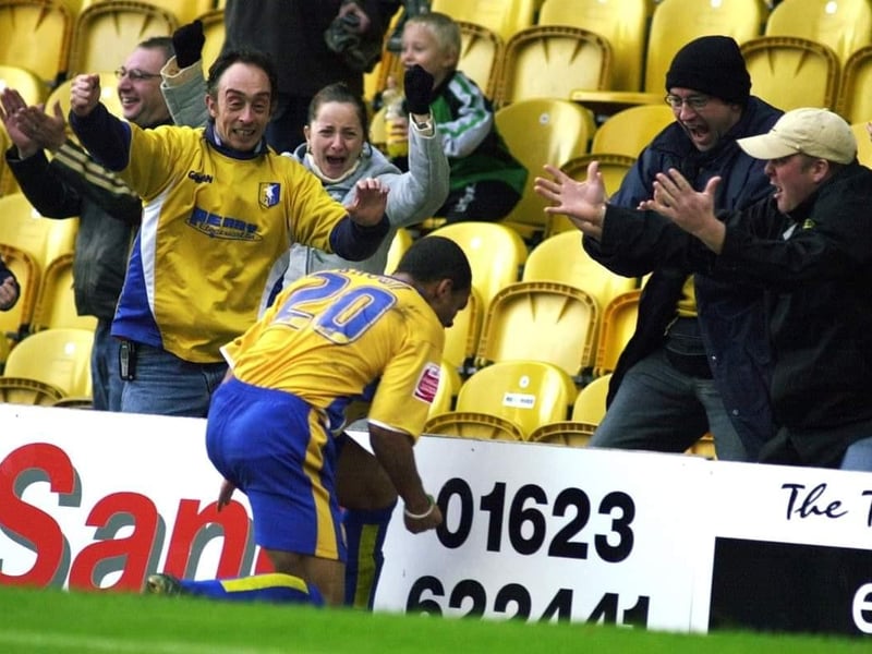 Simon Brown celebrates with the fans during their emphatic 4-0 win on October 22.