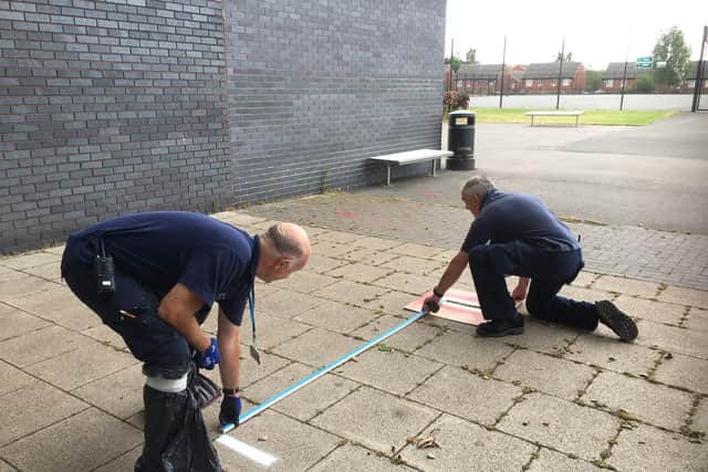 Two metres being measured and marked out
