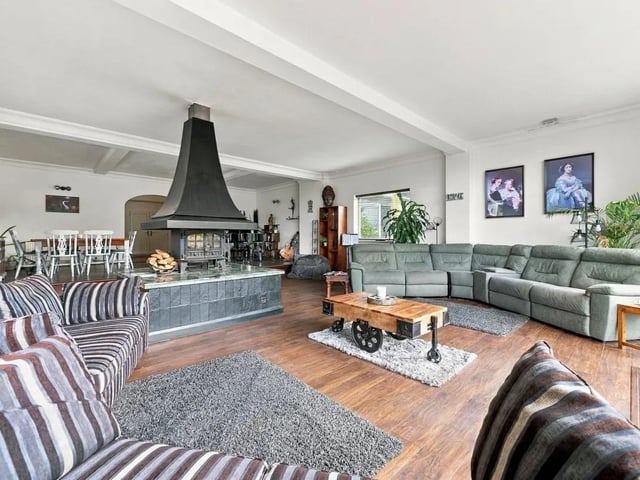 The full-width wall of glass fills the space with natural light