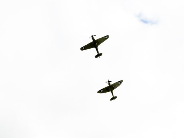 Flying high a Supermarine Spitfire and a Hawker Hurricane over Sutton Lawn