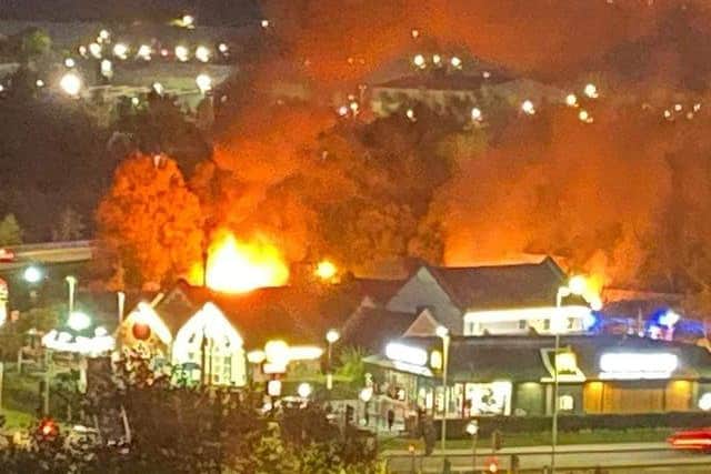 Flames light up the night sky behind the King's Mill Farm pub in Sutton this evening. Photo: Simona Sprowell