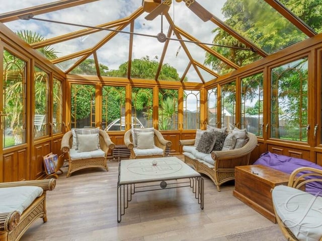 Here is the commanding conservatory, which is not only a pleasant, spacious room in its own right that can be utilised all year round, it also showcases views of the garden and offers easy access outside. The wooden floor injects character..