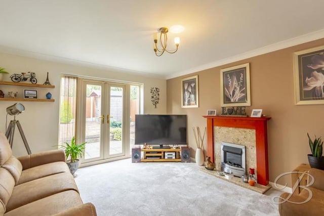 The main reception room in the house is this delightful lounge, which offers an abundance of space in which to add your personal stamp. The highlights are a feature fireplace and French doors that lead out to the back garden. The floor is carpeted.