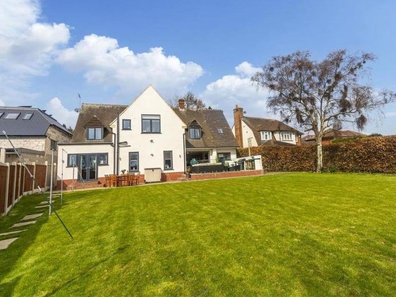 Time to step outside now, and here is a view of the rear of the property from the extensive lawn in the back garden.