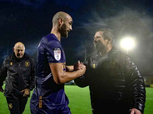 Farrend Rawson and Nigel Clough celebrate Clough's first league win as Mansfield Town manager at Forest Green Rovers on November 14, 2020.