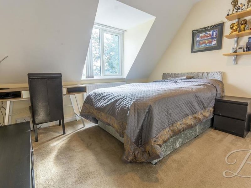 All five bedrooms are versatile. This one has space for a desk and other furniture.