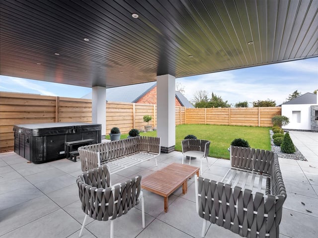 The large undercover seating area to the rear provides a superb entertaining area with ample ceiling spotlights and space to house a hot tub.