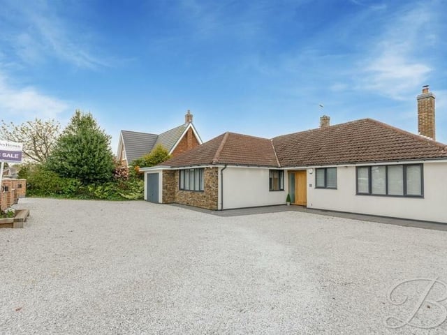 We close our gallery by returning to the front of the £535,000-plus bungalow, where a gravelled driveway offers ample off-street parking space for several vehicles and leads to an integral garage.