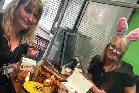 Jigsaw representative Alison Waring receives a £25 cheque from The Nottingham’s Izabella Zygmunt.