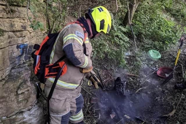 A firefighter extinguishes the blaze.