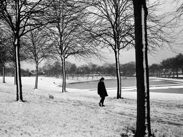 A girl walking beside the frozen pond in Inverleith Park in 1962.