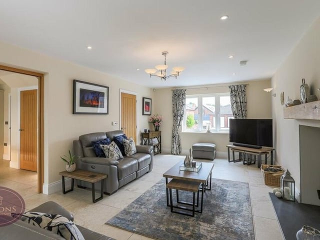 Let's start our tour of the £700,000 Selston house in the spacious and stylish lounge, which is the main reception room on the ground floor. Doors lead to both the dining kitchen and the orangery, while underfloor heating sits beneath an Italian porcelain tiled floor.