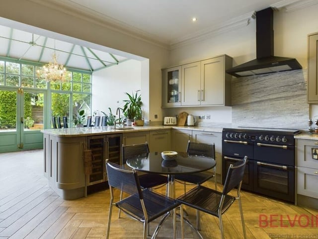 Modern, integrated appliances within the kitchen include a free-standing range cooker with gas hob and double oven, microwave, 50/50 fridge freezer and dishwasher. As you can see, the kitchen opens into the garden room or orangery.