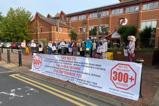Residents turnout to protest at the beginning of the two-week inquiry.