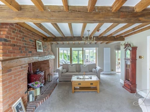 As well as the beams, the lounge includes a feature fireplace with log-burner and exposed brick surround, which creates a pleasant focal point.