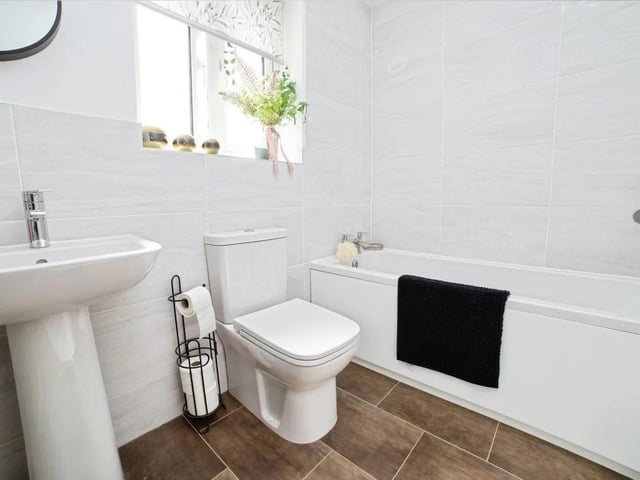Double glazed window to the rear and a heated towel rail. A three peice suite comprising; bath, WC and wash hand basin. Tiled walls and vynl flooring.