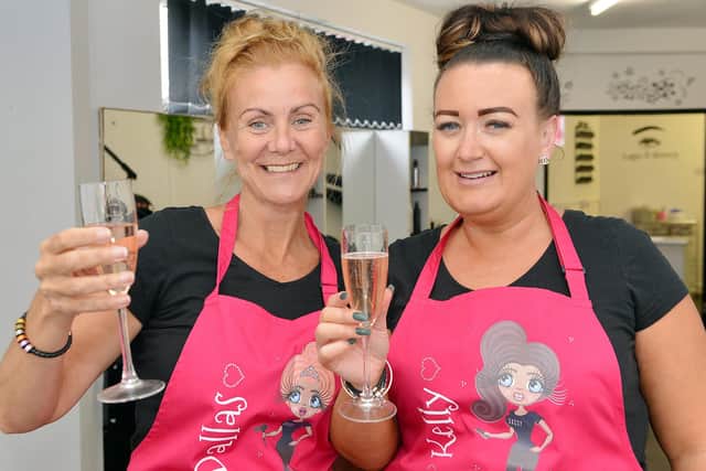'Terrible twosome' Dallas Seamer and Kelly Moore raise a glass to the 2nd Generation hair salon.