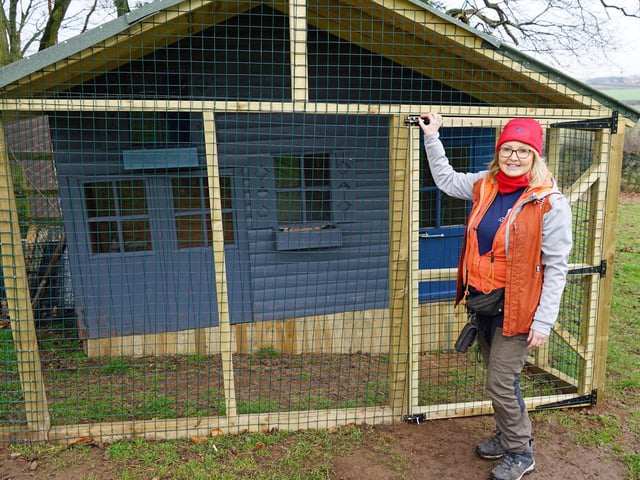 Denise Hardwick with Sid's chalet. Every dog is given a second, third and even fourth chance regardless of their breed or background.
