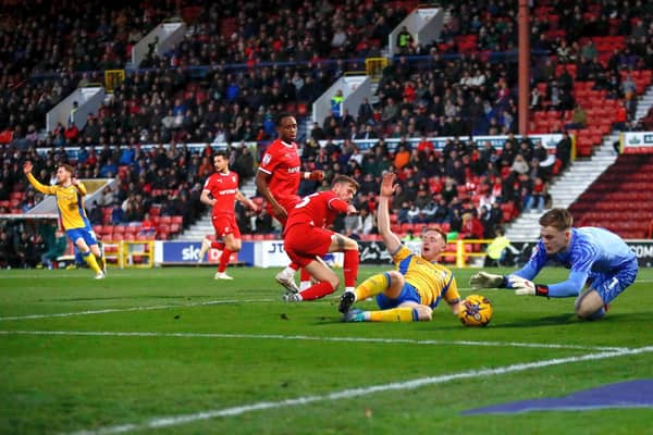 Davis Keillor-Dunn has a penalty shout waved away at Swindon. Photo by Chris & Jeanette Holloway / The Bigger Picture.media