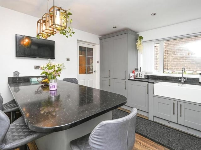 The first room we look at is this newly-fitted kitchen, which includes a centre island or breakfast bar