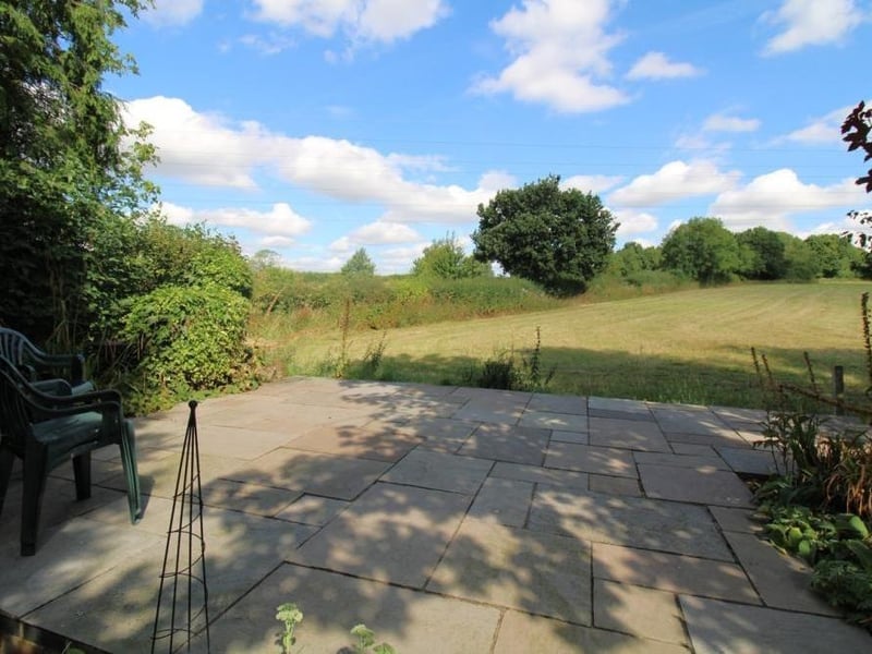 This secluded patio is an idyllic spot to plant yourself during the summer.