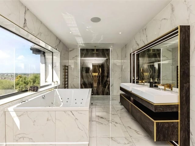 The high specification ensuite bathroom in the master features a window offering a stunning aspect view.