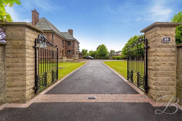A few exterior images now, beginning with this gateway, which offers a majestic entrance to the £650,000-plus property. The tarmacked driveway provides ample off-street parking space.