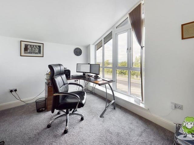 The third bedroom, which is on the third floor of the Mansfield home, can also be converted into an office or study. The large window, facing the front of the house, offers stunning views across the town.