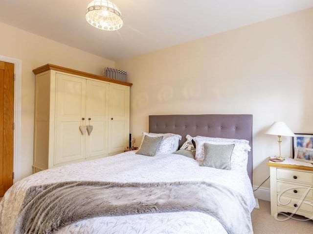 A second shot of the second bedroom, with its fitted wardrobes.