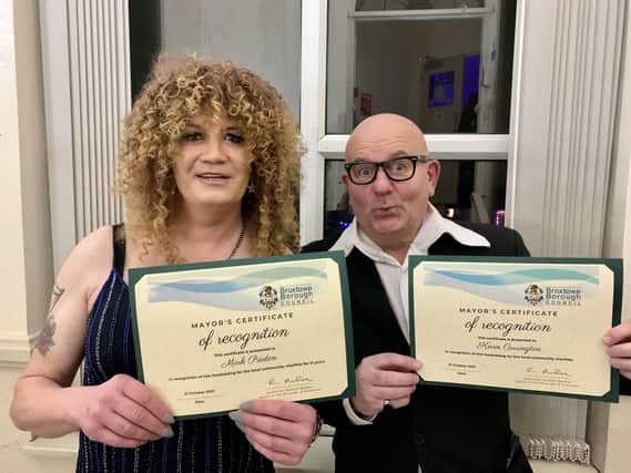 Mark Preston, aka Miss Zandra, and Kevin Carrington, as Harry Hill, with their certificates of recognition from Broxtowe Borough Council.