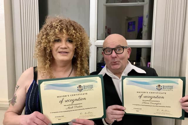 Mark Preston, aka Miss Zandra, and Kevin Carrington, as Harry Hill, with their certificates of recognition from Broxtowe Borough Council.