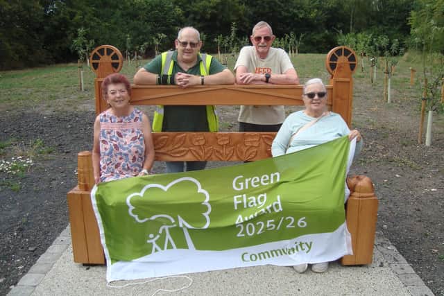 The Friends of Brinsley Headstocks with their Green Flag at the new memorial bench. Photo: Submitted