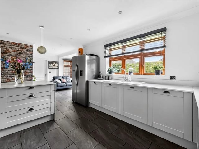 The kitchen is well-proportioned and offers ample space for modern appliances and storage.