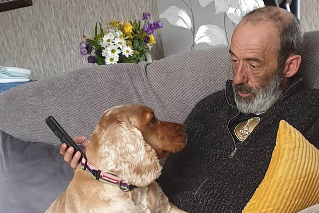Mark Metcalfe back home after his heart-attack scare and enjoying the fuss of his pet dog.
