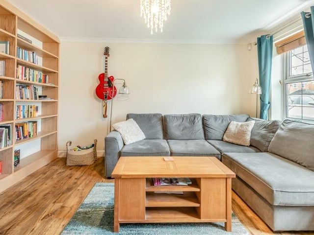 A feature of the lounge is its fitted, floor-to-ceiling bookshelves.